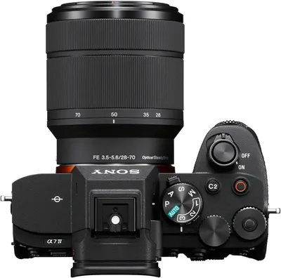 Provides a clean, catalog-style view of the Sony camera with lens from above, allowing shoppers to see the product's physical appearance, controls, and design without distractions.