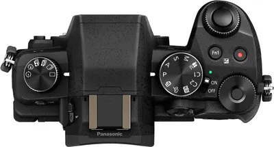Provides a clean, detailed view of the camera's top control layout and interface to help shoppers understand the physical design and button placement.