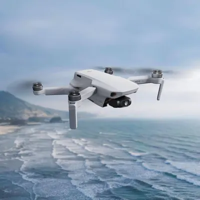 Demonstrates the drone in a real-world outdoor environment to help shoppers visualize the product in action and its capability for capturing scenic aerial footage.