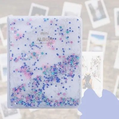Displays the mini photo album product in a clean, catalog-style presentation to show its physical appearance and decorative design with glitter stars.