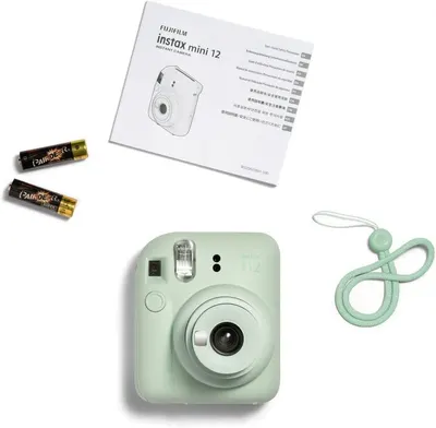 Shows everything included in the box to reassure shoppers they are getting a complete kit with the camera, batteries, instruction manual, and carrying strap.