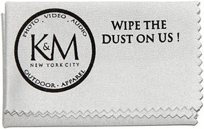 Communicates the brand identity (K&M New York City) and their product categories (Photo, Video, Audio, Outdoor, Apparel) while using a playful tagline to invite shoppers to try the cleaning cloth…
