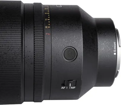 Provides a clean, detailed view of the camera lens showing its physical design, build quality, and controls without distractions.