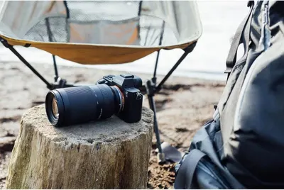Demonstrates the product in a real-world outdoor adventure setting to help shoppers visualize using the camera during camping, hiking, or travel activities.