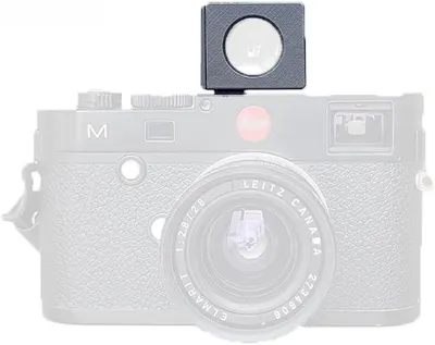 Displays the camera with an external viewfinder accessory on a clean white background to show the product clearly without distractions.