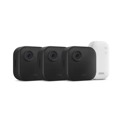 Shows the complete bundle contents to help shoppers understand they receive three security cameras plus the sync module hub in one purchase.