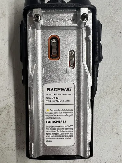 Shows the back of the product with brand name, model information, and regulatory compliance details to provide shoppers with technical specifications and certification information.