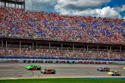 Demonstrates the product in a real-world racing environment at Talladega Superspeedway, showing the product's application in professional motorsports to build excitement and authenticity.