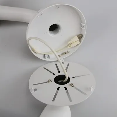 Shows the internal structure and assembly of the product, revealing how the mounting plate, wiring, and connection points are configured to help shoppers understand the product's construction and…