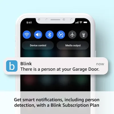 Demonstrates the product's ability to send real-time mobile notifications when a person is detected at the garage door, reassuring shoppers about security and awareness features.