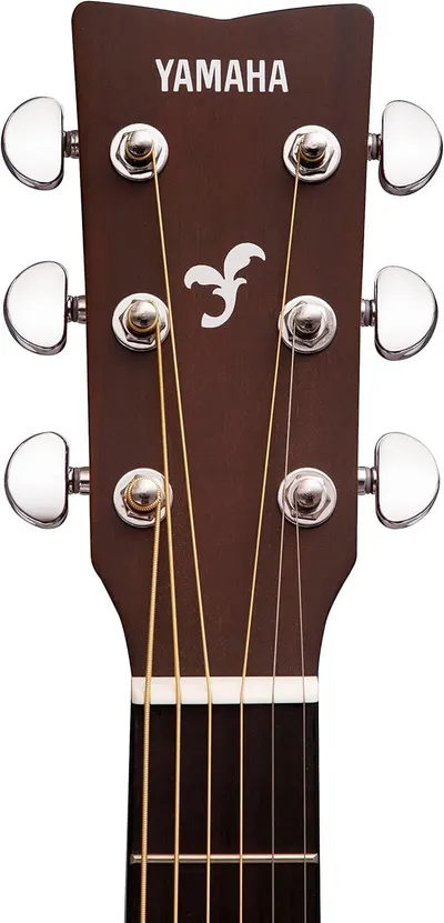 Displays the product on a clean white background to show the Yamaha guitar headstock, tuning pegs, and brand logo clearly for catalog purposes.