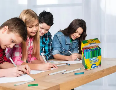 Demonstrates the product being used by children in a real-world classroom or homework scenario to help shoppers visualize the product in everyday use.