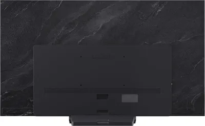 Displays the back of the TV to show the clean design, ports, and build quality of the product.