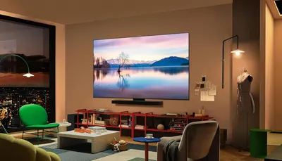 Demonstrates the TV in a real-world living room environment to help shoppers visualize how the product would look and fit in their own home.