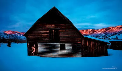 Showcases the product in a beautiful real-world winter mountain environment to create emotional appeal and demonstrate its use in outdoor cold-weather conditions.