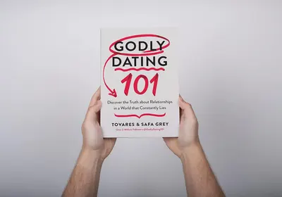 Shows the product (book) in a clean, catalog-style presentation with hands holding it to provide scale and context, allowing shoppers to see the cover design and title clearly.