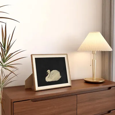 Demonstrates how the product (lamp and/or framed art) fits naturally into a modern home setting, helping shoppers visualize it in their own space.