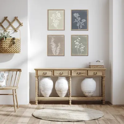Demonstrates how the framed botanical prints look when styled in a real home environment, helping shoppers visualize the product in their own space.