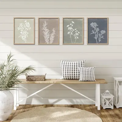 Shows the product (framed botanical prints) styled in a real-world home setting to help shoppers visualize how the artwork would look in their own space.