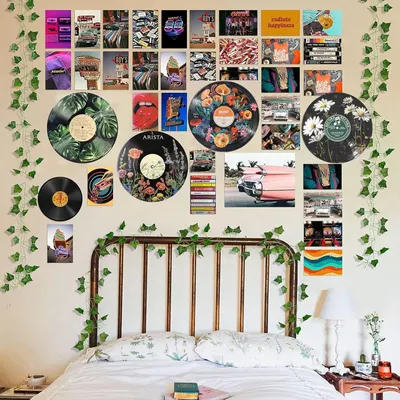 Demonstrates how the product (vinyl records and prints) can be used as decorative wall art in a real-world bedroom setting, inspiring shoppers with styling ideas.