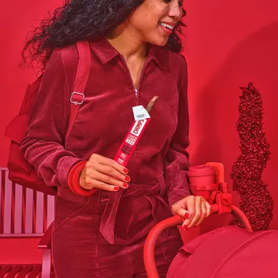 Demonstrates the product in a real-world lifestyle context to show how it fits naturally into the shopper's daily routine and active lifestyle.