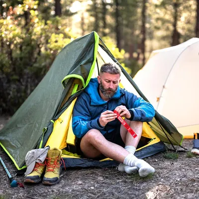 Demonstrates the product in a real-world camping environment to help shoppers visualize using it outdoors in nature.