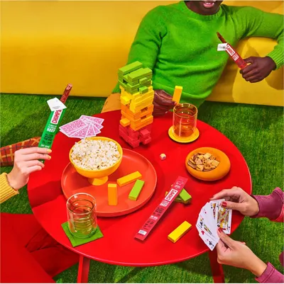 Demonstrates the product being enjoyed in a fun, social setting with friends playing games, positioning it as a snack for entertaining and casual get-togethers.