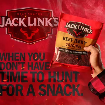 Demonstrates the product in a real-world context, showing it as a convenient, ready-to-eat snack for active lifestyles without the need to hunt for food.