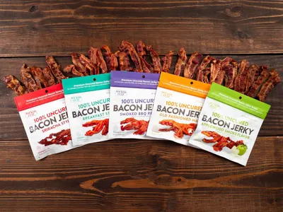 Displays the brand's full product lineup of bacon jerky flavors to help shoppers understand the variety available and choose their preferred option.