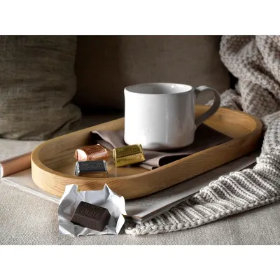 Creates an emotional connection by showing the product in a warm, inviting lifestyle context that suggests comfort and relaxation.