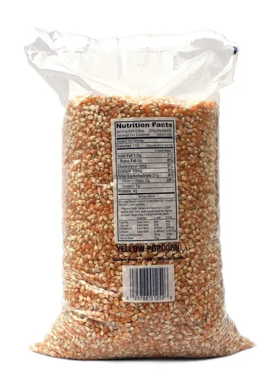 Provides a clean, catalog-style view of the yellow popcorn product in its retail packaging on a white background, allowing shoppers to see the product clearly without distractions.