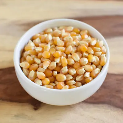 Displays the raw popcorn kernels in a clean, catalog-style presentation to show the product clearly without distractions.