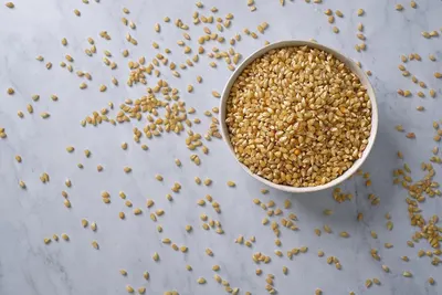 Showcases the product (grains/seeds) in an appealing, natural lifestyle context to help shoppers visualize the product's appearance and quality without any distracting text or claims.