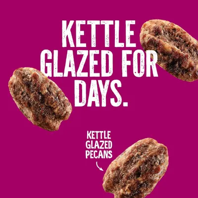 Communicates the unique kettle glazed preparation method of the pecans to emphasize premium quality and artisanal cooking technique.