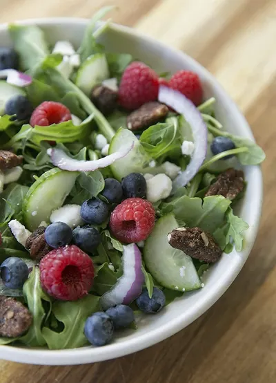 Showcases the product in a real-world dining context to help shoppers visualize the product as part of a healthy, appealing meal.