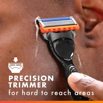 Highlights the precision trimmer feature that allows users to easily shave difficult-to-reach areas, emphasizing convenience and functionality.