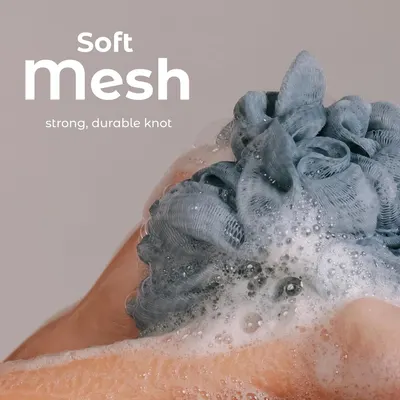 Highlights the soft mesh material and durable knot construction of the bath sponge to communicate comfort and longevity to shoppers.