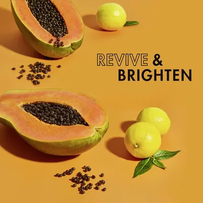 Communicates that the product contains natural ingredients (papaya and lemon) that revive and brighten skin, appealing to shoppers seeking skincare benefits.