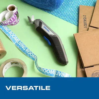 Demonstrates the product's versatility by showing it in a context with various materials (bubble wrap, tape, cardboard boxes), suggesting it can be used for multiple applications like packaging,…