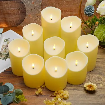 Showcases the candles in a warm, inviting home setting with decorative elements to help shoppers visualize the product creating ambiance in their own space.