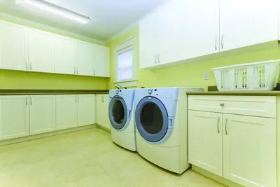 Demonstrates the product in a real-world home environment to help shoppers visualize the washer and dryer in their own laundry space.