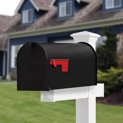 Demonstrates the product in a real-world residential environment to help shoppers visualize how the mailbox would look installed at their home.
