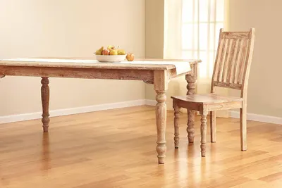 Showcases the product in a real-world home environment to help shoppers visualize how the furniture would look in their own dining space.