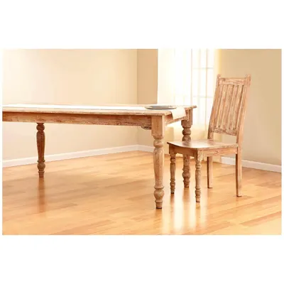 Showcases the product in a real-world home environment to help shoppers visualize how the furniture would look in their own dining space.