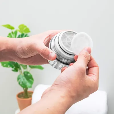 Demonstrates how to open or access the product, showing the simple twist-off mechanism to reassure shoppers about ease of use. Highlights the straightforward, accessible design of the product in a…