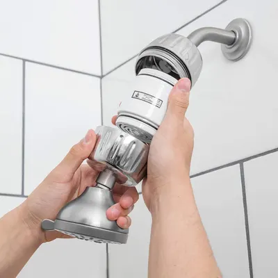 Demonstrates how simple it is to install or attach the shower filter by showing hands performing the installation process, reassuring shoppers that setup requires no special tools or expertise.…