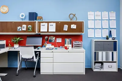 Demonstrates the product in a real-world office environment to help shoppers visualize how the furniture and organizational products work together in an actual workspace setting.