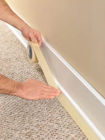 Demonstrates how simple it is to install the product by showing hands applying tape along the baseboard, reassuring shoppers that installation requires no special tools or expertise. Highlights the…
