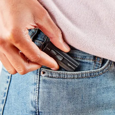 Demonstrates that the product is small and portable enough to fit comfortably in a jeans pocket, emphasizing convenience and portability for everyday carry.