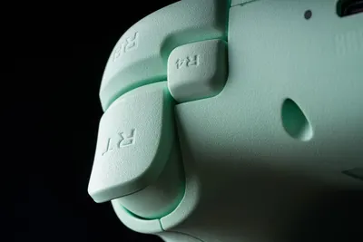 Displays the gaming controller in a clean, professional manner to showcase its design, texture, and button layout without distractions.